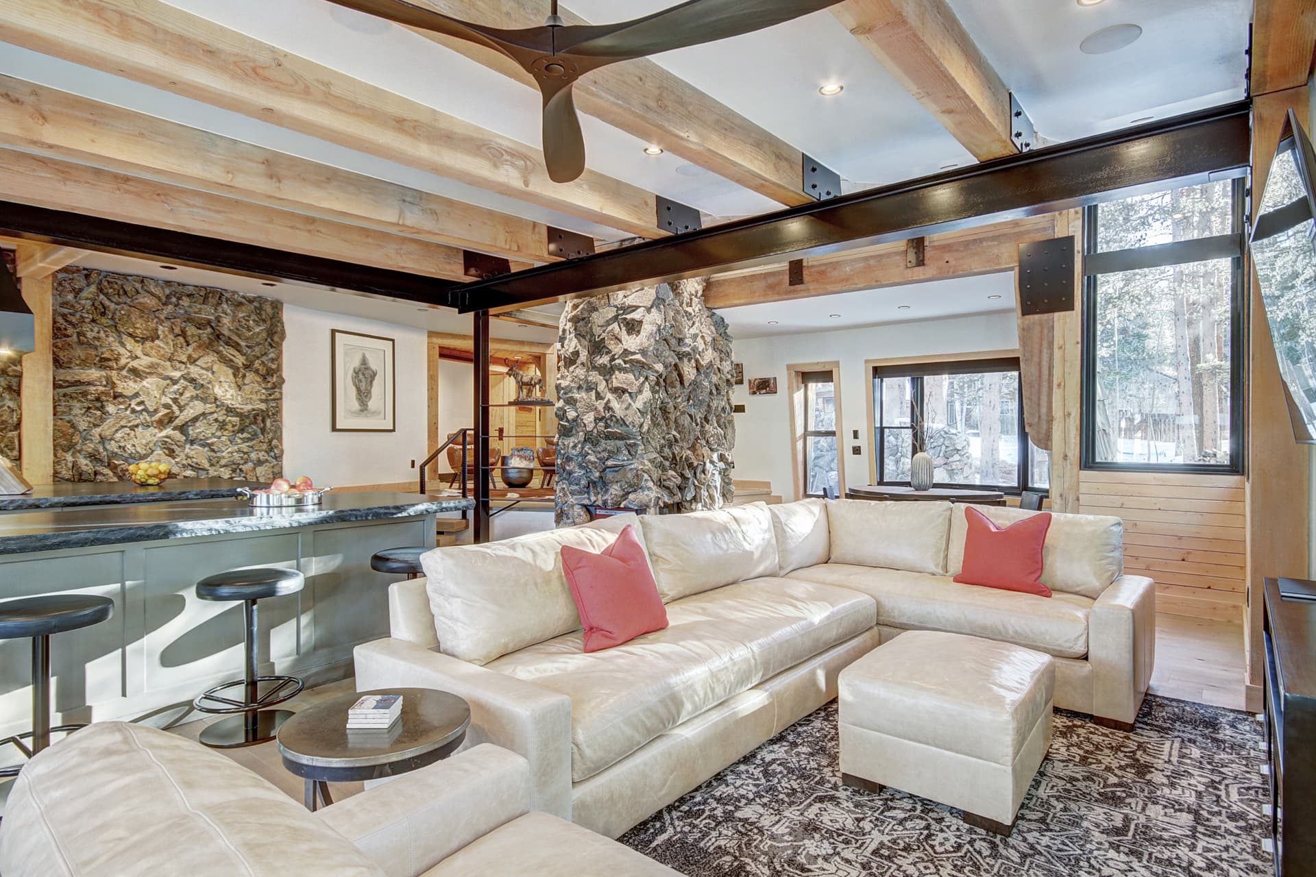 Relax on the living room sectional sofa to take in the wooded view or a watch a movie on the flat screen TV - Arrow Darrow Breckenridge Vacation Rental