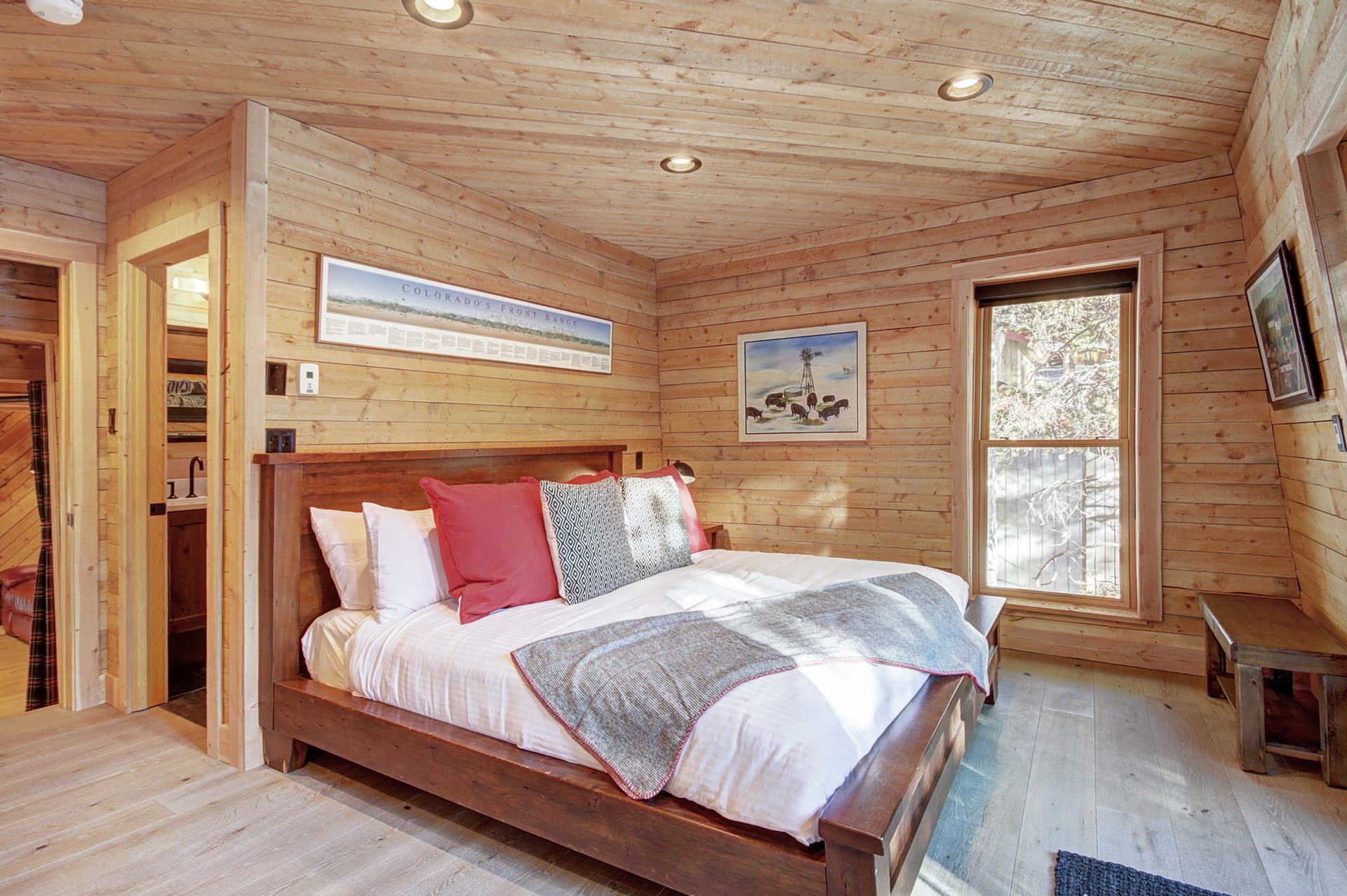 Upper level primary suite with King-size bed, private deck, and private bath - Arrow Darrow Breckenridge Vacation Rental