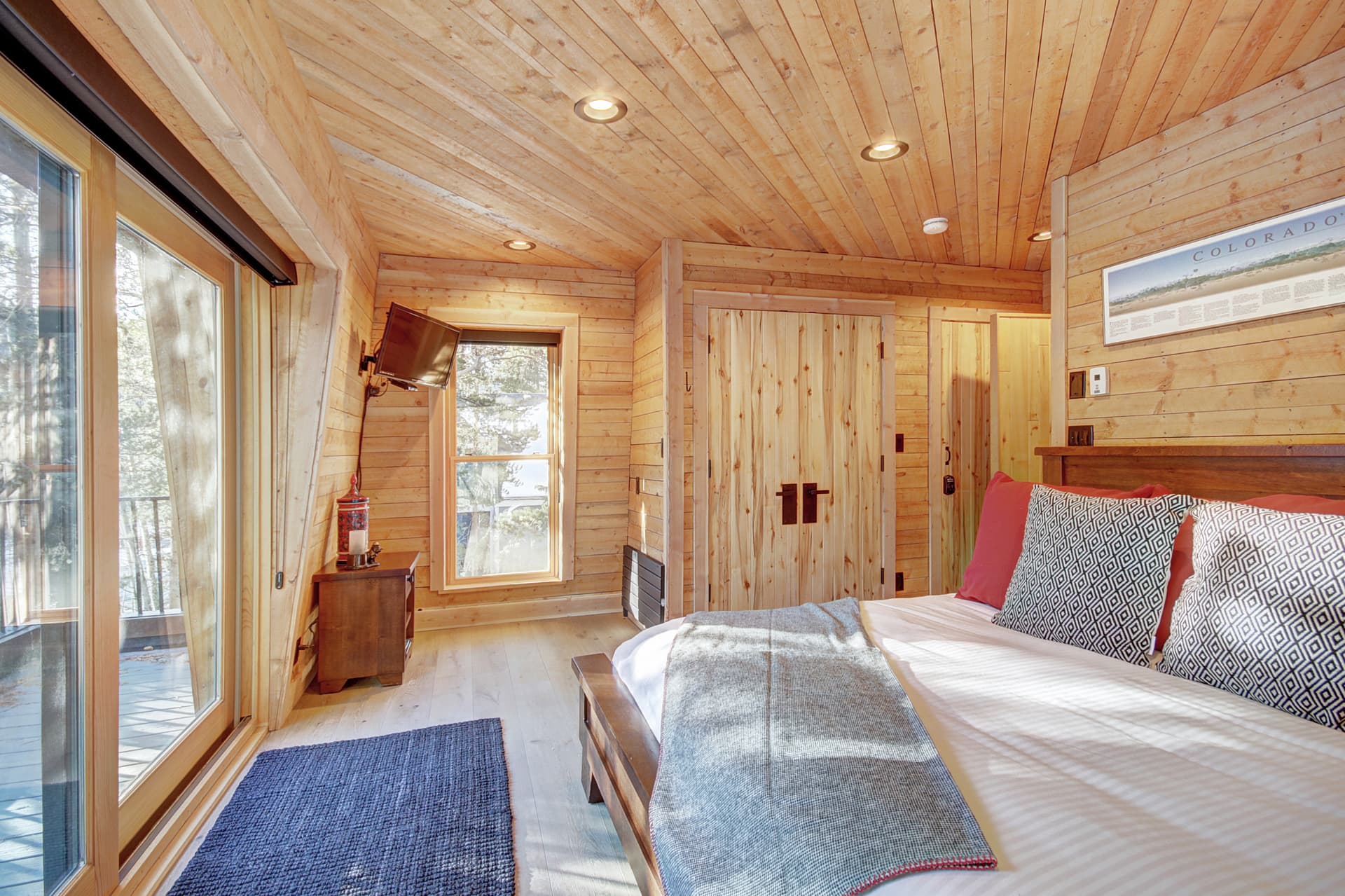 Upper level primary suite with King-size bed, private deck, and private bath - Arrow Darrow Breckenridge Vacation Rental