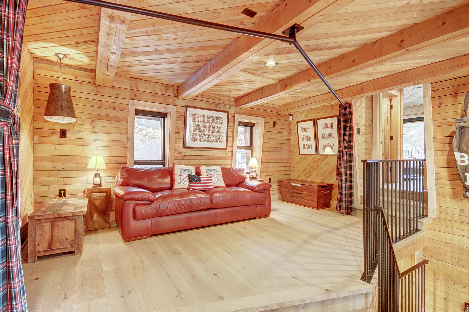 Upper level family room showing sleeper sofa with privacy curtain - Arrow Darrow Breckenridge Vacation Rental