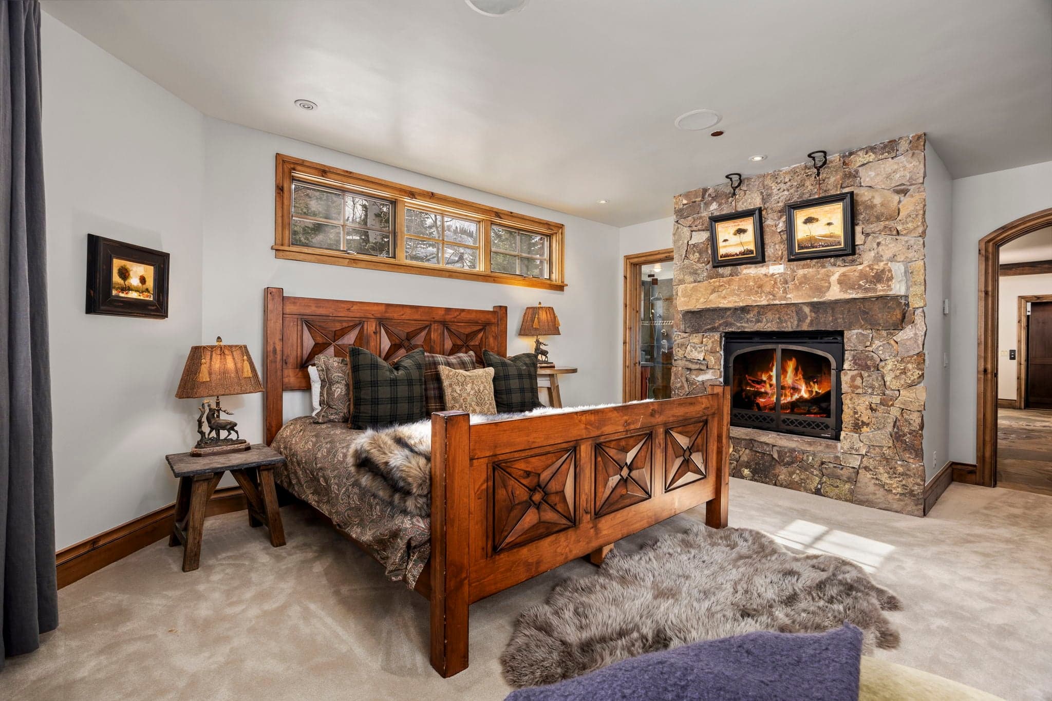 guest suite with large fireplace and windows